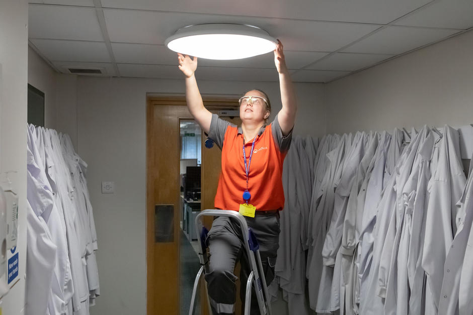 Veolia worker working on light